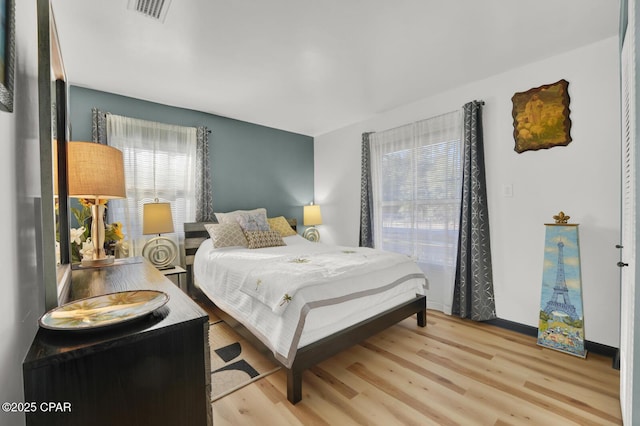 bedroom with light wood-type flooring