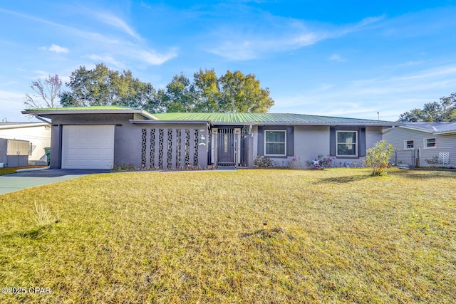 single story home with a garage and a front lawn