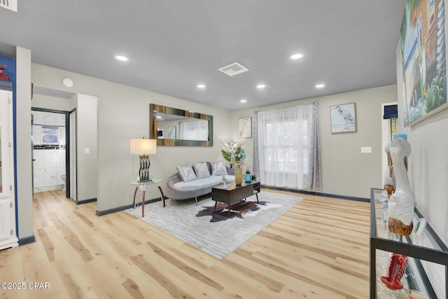 living room with light hardwood / wood-style floors