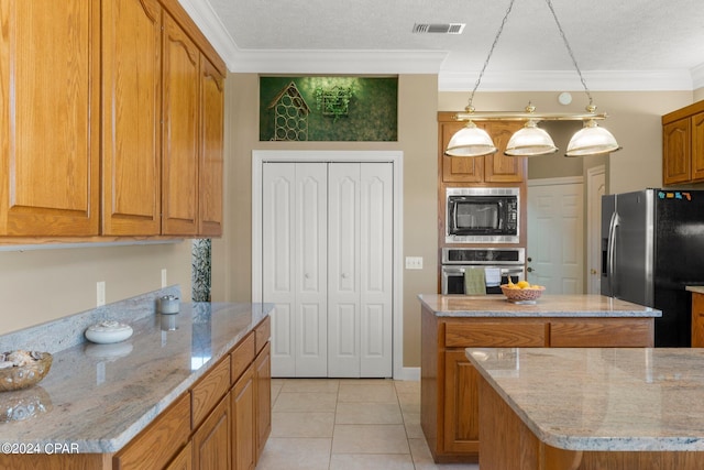 kitchen with hanging light fixtures, a textured ceiling, a center island, ornamental molding, and stainless steel appliances