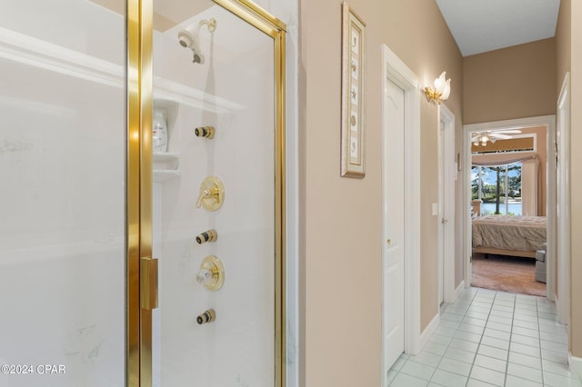 bathroom with ceiling fan, tile patterned floors, and an enclosed shower