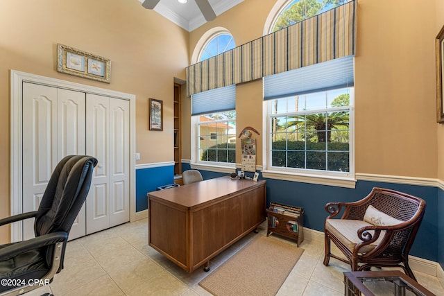 office area with ceiling fan, plenty of natural light, light tile patterned floors, and crown molding