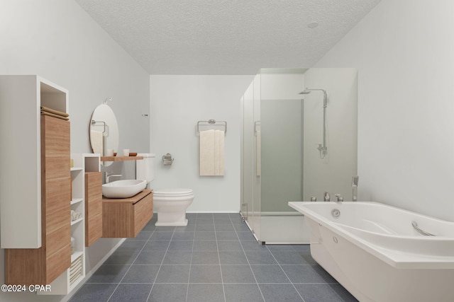 full bathroom featuring toilet, a textured ceiling, vanity, and shower with separate bathtub