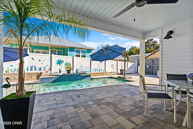 view of pool featuring a patio area, pool water feature, and ceiling fan