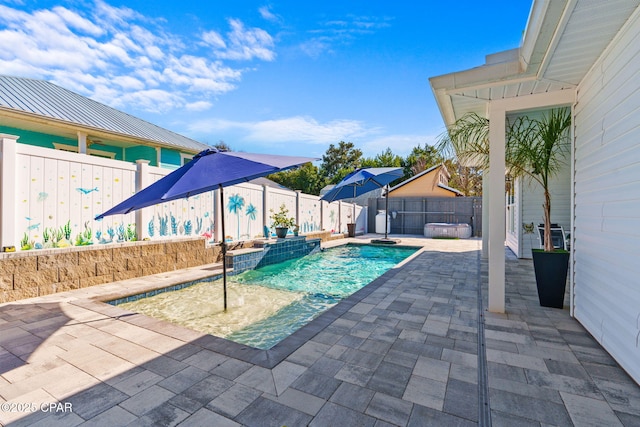 view of swimming pool with a patio area and pool water feature