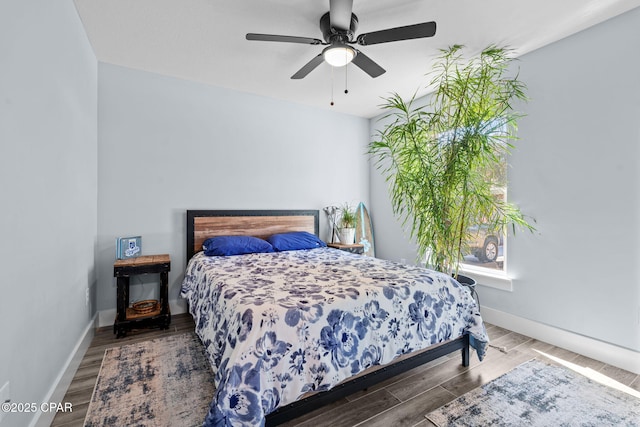 bedroom featuring dark wood-type flooring and ceiling fan