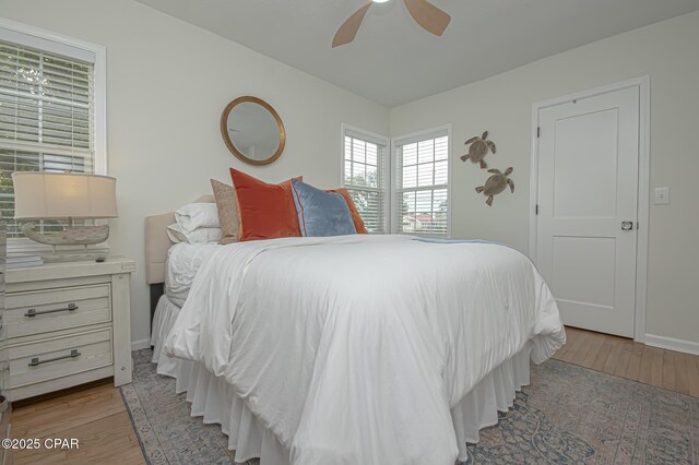 bedroom featuring ceiling fan and light hardwood / wood-style floors