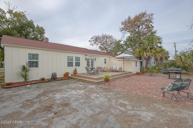 rear view of house with a wooden deck