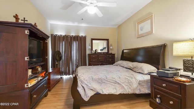 bedroom with ceiling fan and light hardwood / wood-style flooring