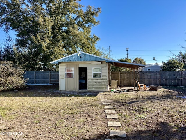 view of outbuilding with a yard