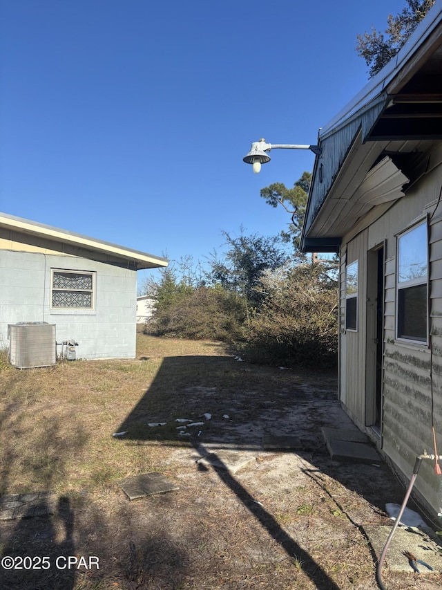 view of yard featuring central AC