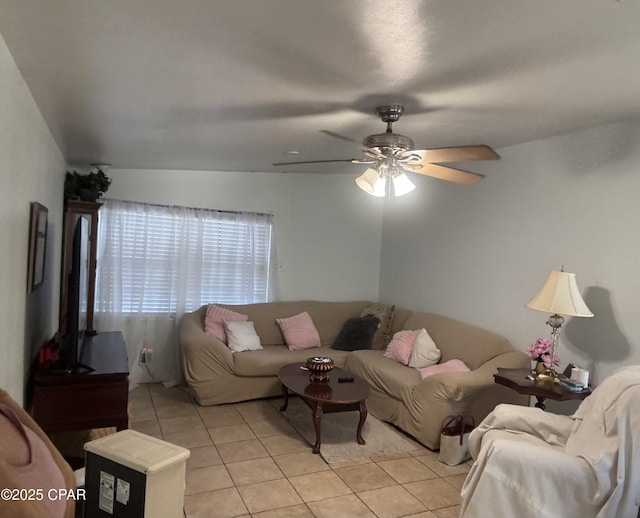 living room featuring ceiling fan and light tile patterned floors