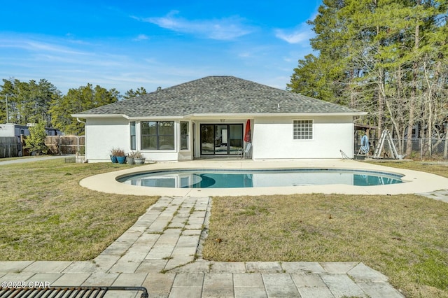 view of swimming pool with a patio area and a lawn