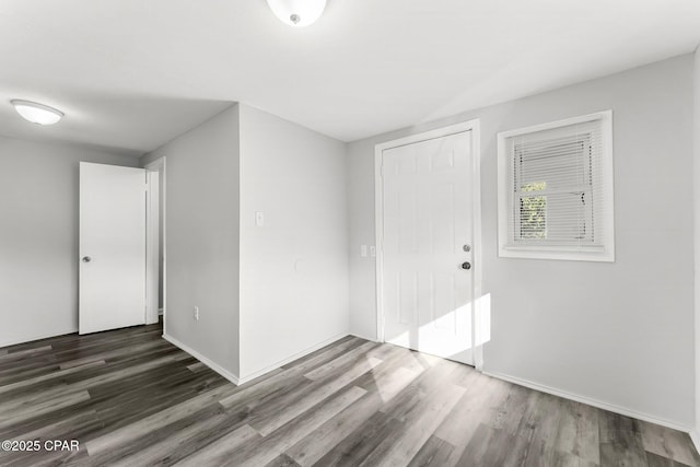 spare room featuring dark hardwood / wood-style floors