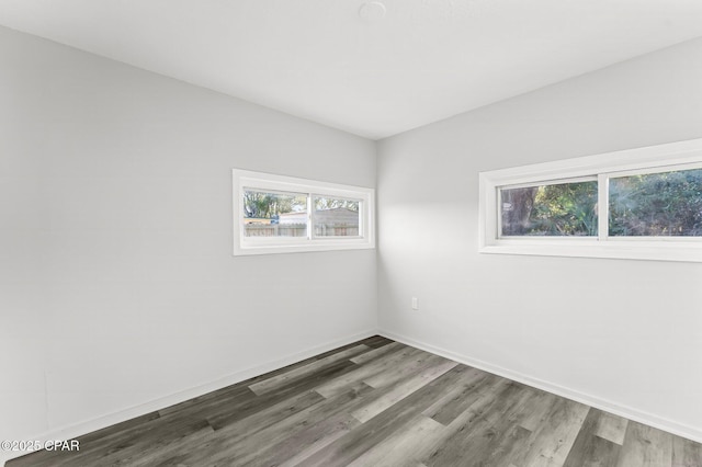 spare room featuring dark hardwood / wood-style flooring