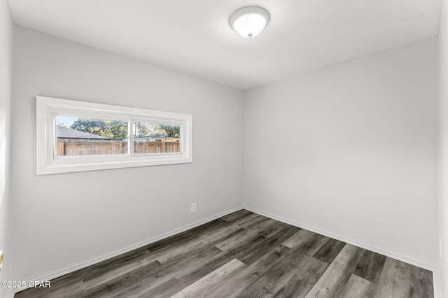 1905 W 17th St, Panama City, FL 32405 - unfurnished room featuring baseboards and dark wood-style floors