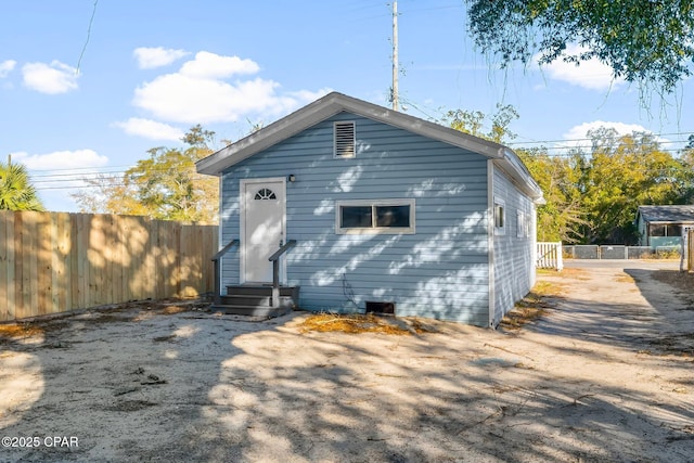1905 W 17th St, Panama City, FL 32405 - rear view of property featuring entry steps, fence, and crawl space