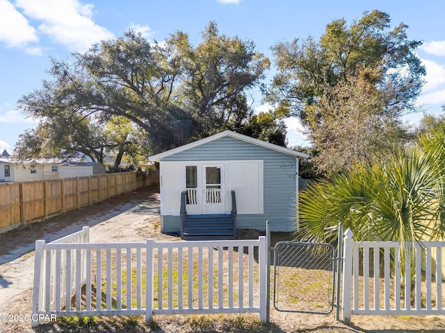 1905 W 17th St, Panama City, FL 32405 - exterior space featuring an outdoor structure, a gate, and a fenced front yard