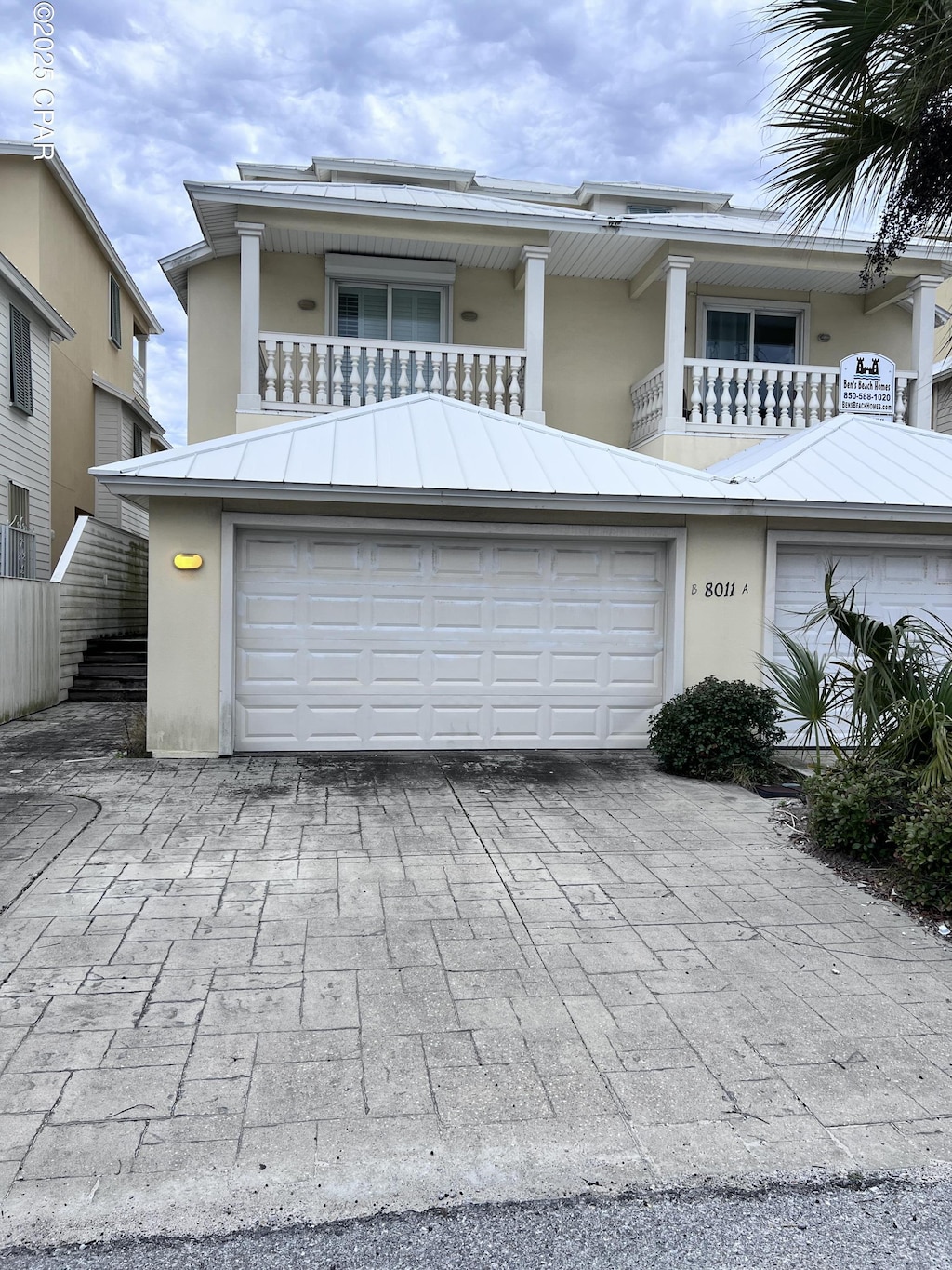 view of front of house with a balcony and a garage