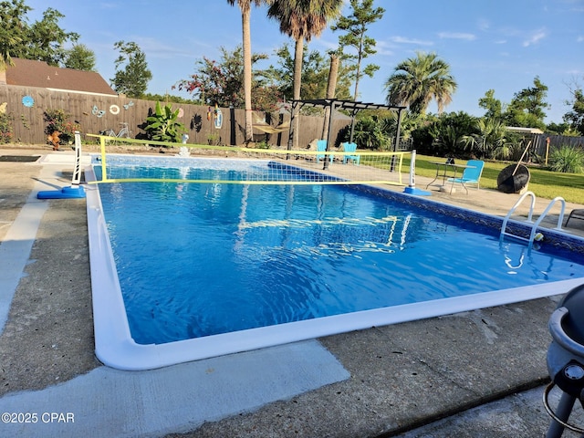 view of pool featuring a patio and a pergola