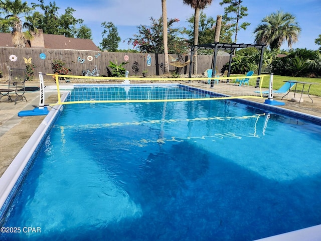 view of swimming pool with a pergola