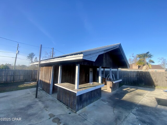 exterior space featuring exterior bar and a patio area