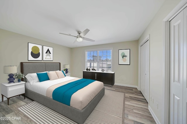 bedroom featuring hardwood / wood-style flooring and ceiling fan