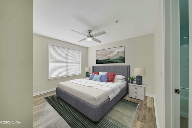 bedroom featuring light hardwood / wood-style flooring and ceiling fan