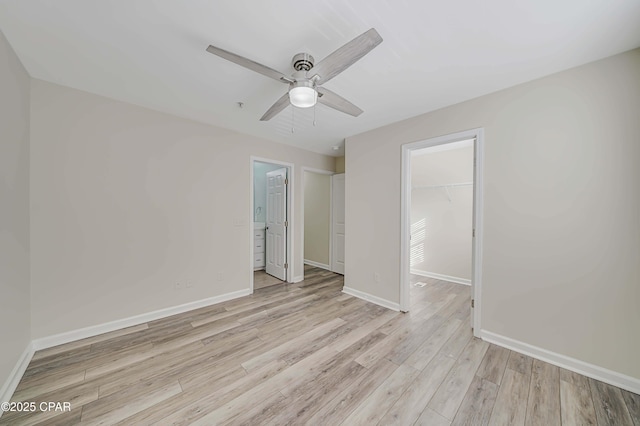 spare room featuring light hardwood / wood-style flooring and ceiling fan