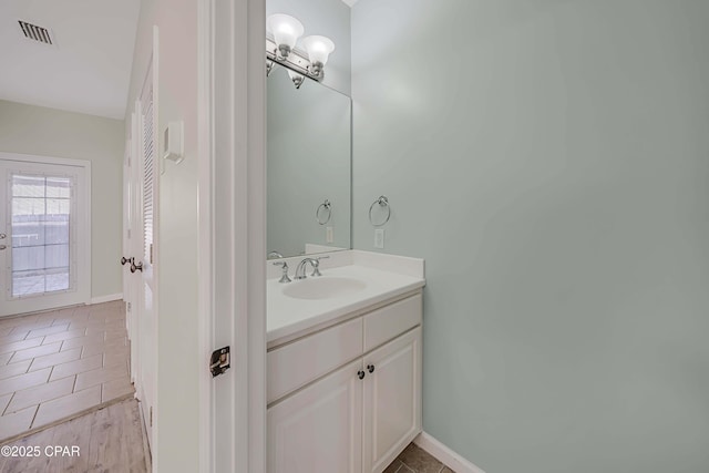 bathroom with vanity and tile patterned flooring