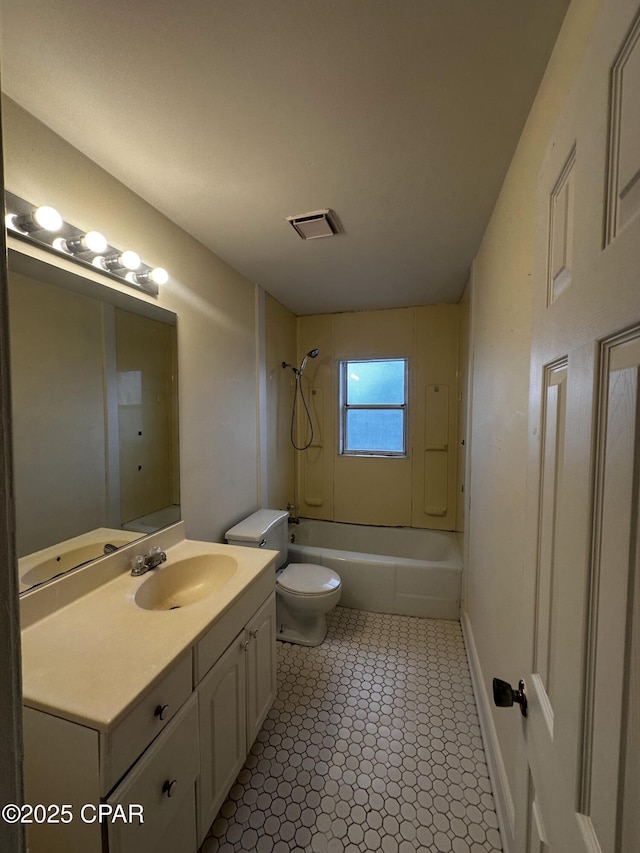 bathroom with visible vents, toilet, vanity,  shower combination, and baseboards