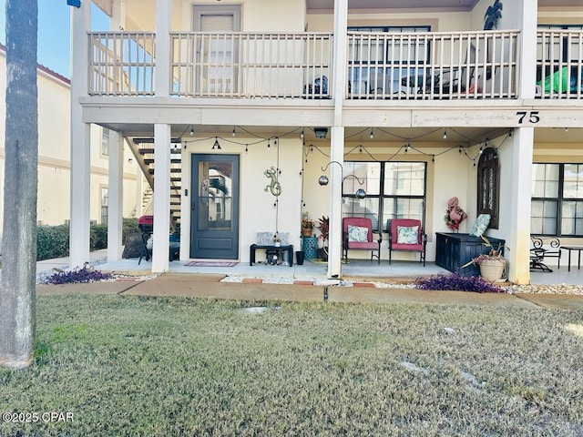 entrance to property featuring a balcony