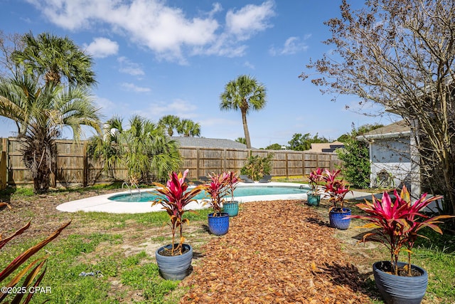 view of yard featuring a fenced in pool and a fenced backyard