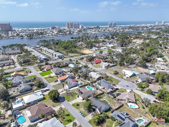 birds eye view of property with a water view