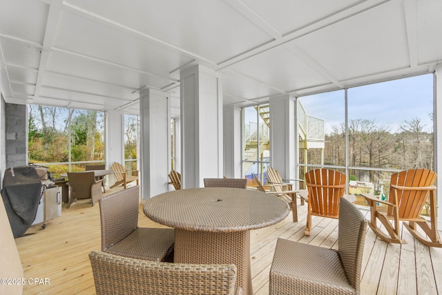 sunroom with coffered ceiling and a wealth of natural light