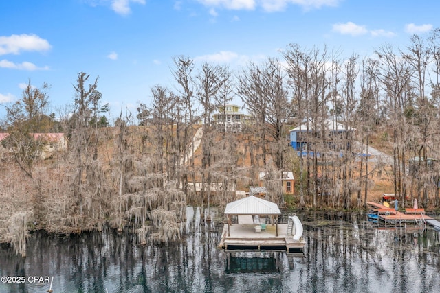 dock area with a gazebo and a water view