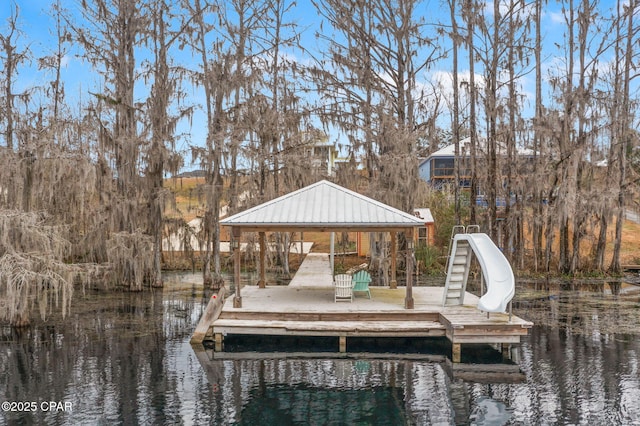 dock area featuring a gazebo and a water view