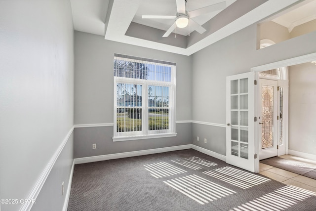 carpeted empty room with ceiling fan