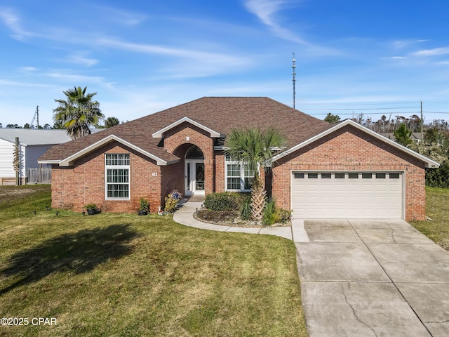 single story home with a garage and a front yard