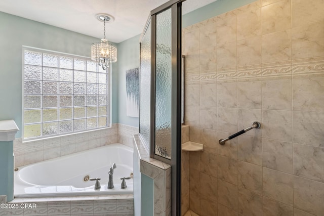 bathroom with shower with separate bathtub, a healthy amount of sunlight, and a notable chandelier