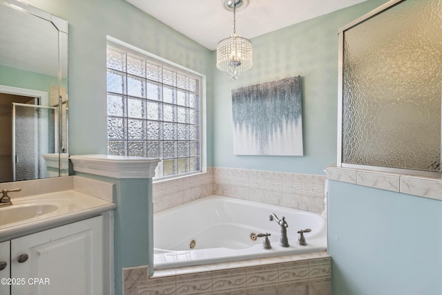 bathroom with plenty of natural light, plus walk in shower, a chandelier, and vanity