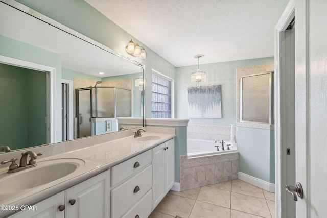 bathroom featuring independent shower and bath, vanity, tile patterned flooring, and a textured ceiling