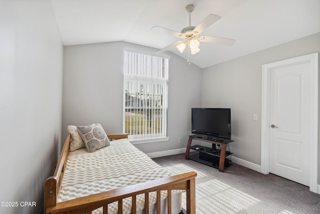 carpeted bedroom featuring vaulted ceiling and ceiling fan