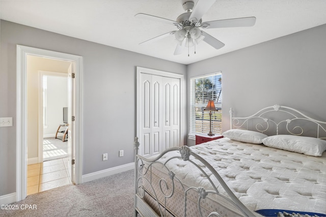 bedroom featuring ceiling fan, carpet floors, and a closet