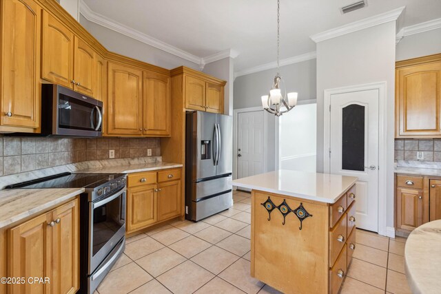 kitchen with decorative backsplash, a center island, light tile patterned floors, stainless steel appliances, and crown molding