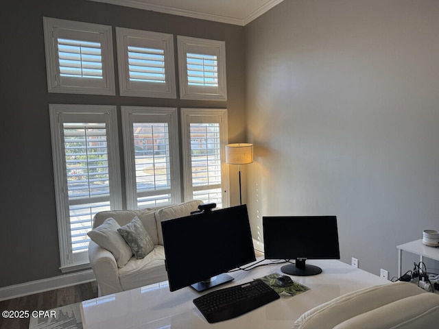 home office with wood-type flooring and ornamental molding