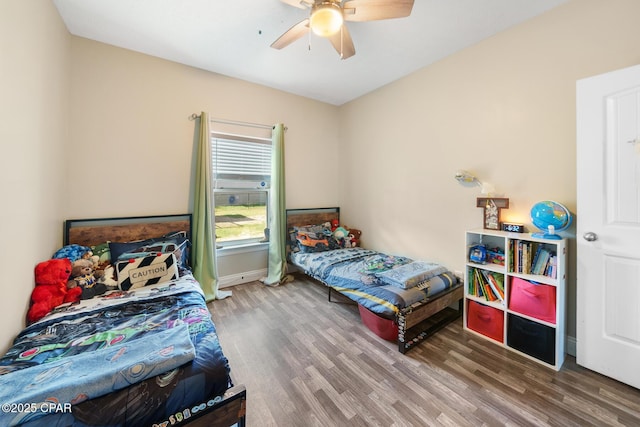 bedroom featuring hardwood / wood-style floors and ceiling fan