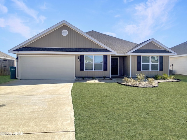 view of front of house featuring a garage and a front lawn