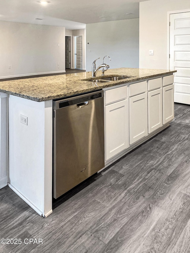 kitchen with white cabinetry, stainless steel dishwasher, sink, and stone counters