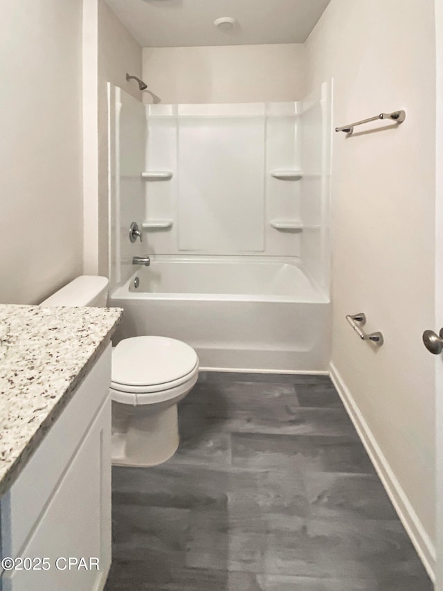 full bathroom with shower / tub combination, hardwood / wood-style floors, vanity, and toilet